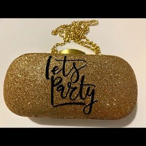 Never worn, Gold charming Charlie Clutch Purse. Snap closure.